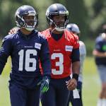 Seahawks wide receiver Tyler Lockett (16) walks off the field with quarterback Russell Wilson (3) following a practice on June 4, 2019, in Renton. (AP Photo/Ted S. Warren)