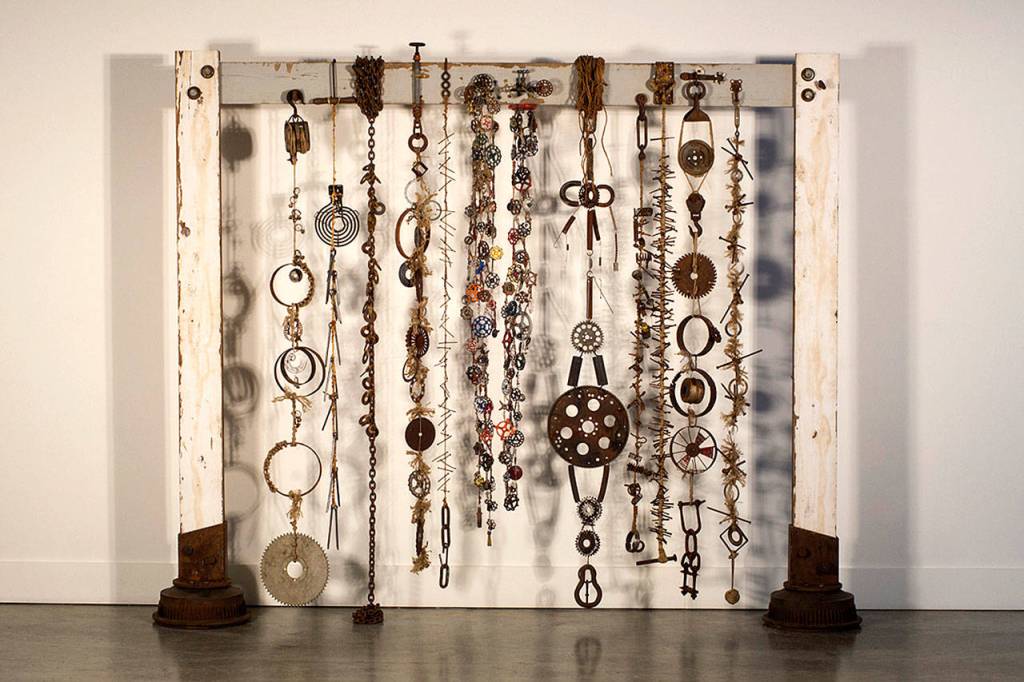 Shadow Play is a 8-by-10-foot curtain of an eclectic selection of found metal items, reclaimed wood, ropes and chains. Old faucet handles were morphed into an exploration of shadows.