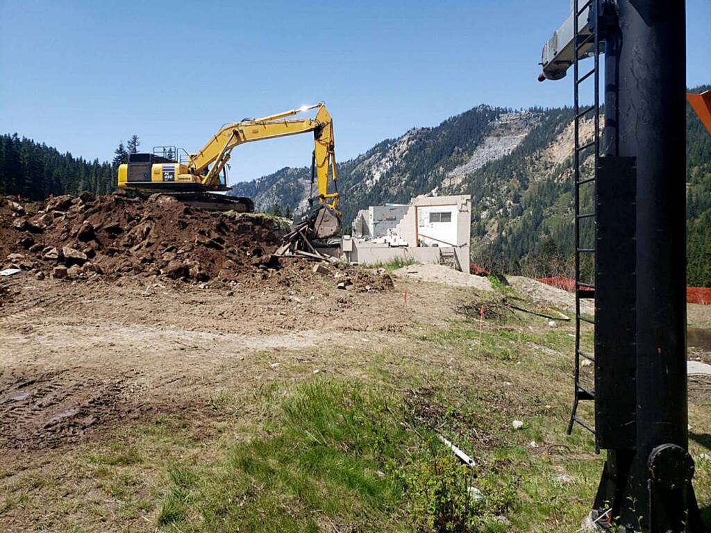 A 50-ton excavator tractor is tearing down the lift shack at Brooks lower terminal. (Vail Resorts)