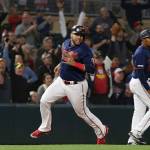 The Twins Nelson Cruz heads home to score during the eighth inning of a game against the Mariners on June 11, 2019, in Minneapolis. (AP Photo/Stacy Bengs)