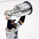 The Blues Alex Pietrangelo carries the Stanley Cup after St. Louis defeated Boston in Game 7 of the Stanley Cup Final on June 12, 2019, in Boston. (AP Photo/Charles Krupa)