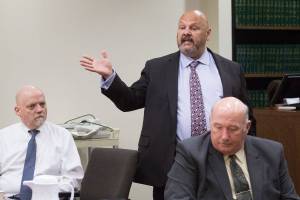 William Talbott II, left, listens as his public defender Jon Scott questions potential jurors at the Snohomish County Courthouse on Thursday, June 13, 2019 in Everett, Wash. Snohomish County sheriffs detective Jim Scharf, right, listens from the prosecutors table. (Andy Bronson / The Herald)