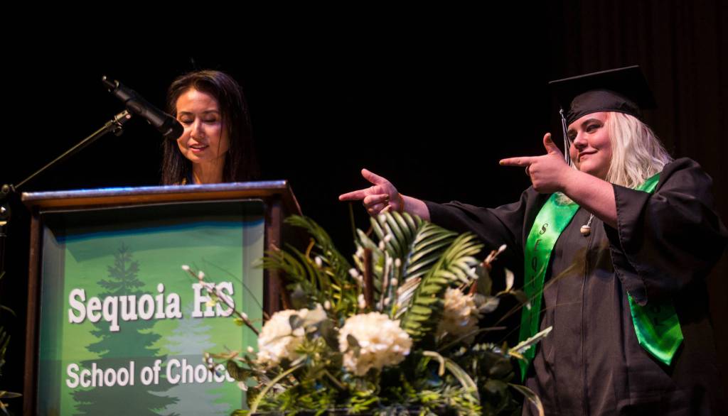 Teacher Bona Park talks about student Alexzandrea Coggins during the Sequoia High graduation ceremony held in the Everett Civic Auditorium on Thursday, June 13, 2019 in Everett, Wash. (Andy Bronson / The Herald)