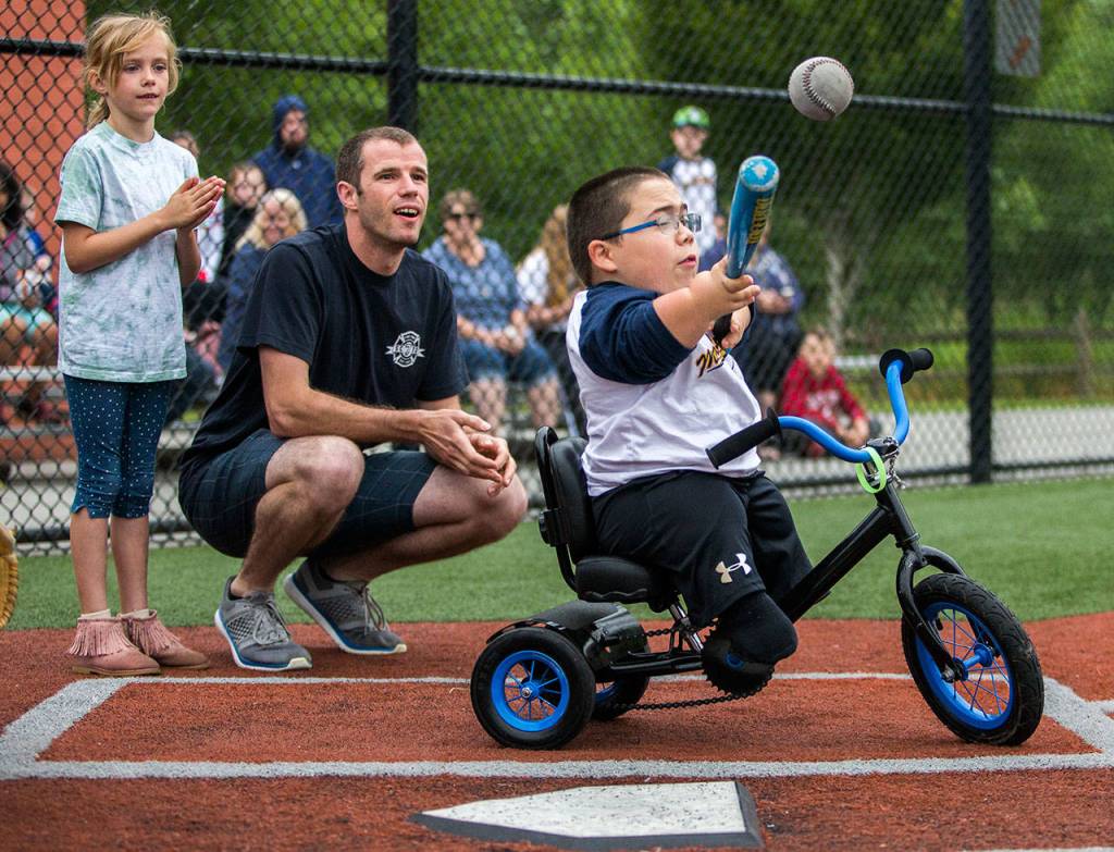 Kai Rivas, 10, takes a swing at the ball. (Olivia Vanni / The Herald)