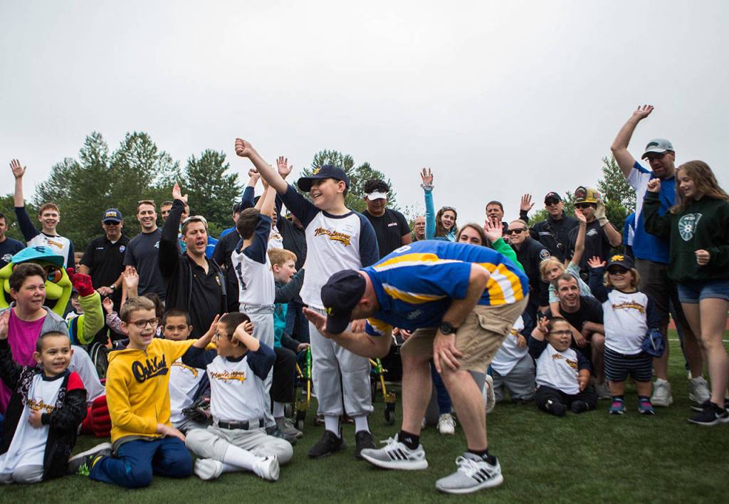 Players cheer after the first of Saturdays three games. (Olivia Vanni / The Herald)