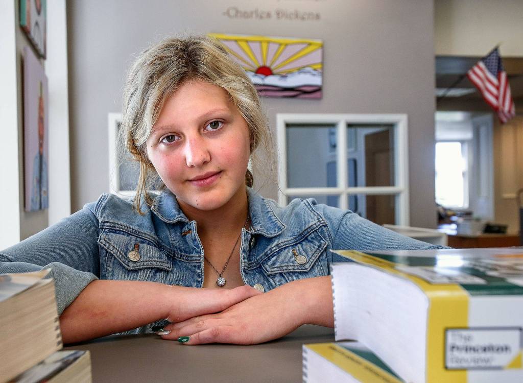 Everett High School graduating senior <a href="https://www.heraldnet.com/news/humility-grit-grace-describe-everett-highs-maggie-kermoade/" target="_blank">Maggie Kermoade</a> has been a wrestler, was involved in Navy JROTC, and, on occasion, donned the schools Sammy Seagull mascot garb. (Dan Bates / The Herald)