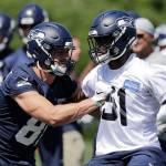 Seattles Nick Vannett (left) battles with Barkevious Mingo during the Seahawks offseason team activity Thursday at the teams training facility in Renton. (AP Photo/Elaine Thompson)