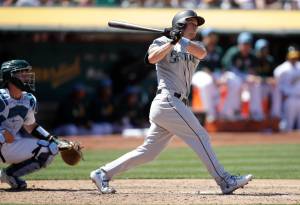 Seattles Kyle Seager watches the two-run double he hit off Oaklands Lou Trivino in the eighth inning of Sundays game in Oakland, California. (AP Photo/Ben Margot)