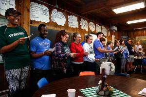 Staff wholl be overseeing kids at Camp Killoqua this summer sing a song Thursday thanking donors to a capital campaign that raised almost $2.2 million for local Camp Fire programs. (Dan Bates / The Herald)