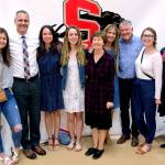 Snohomish High School scholarship recipient Maya DuChesne (middle) surrounded by members of the Roberts family. (Snohomish Education Foundation)