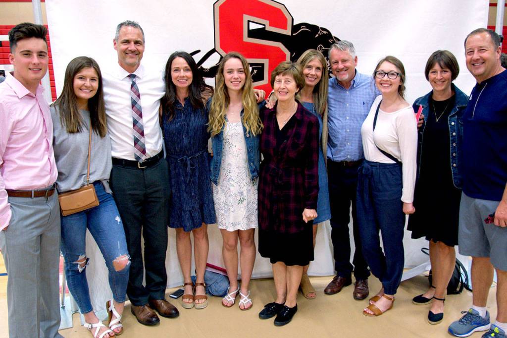 Snohomish High School scholarship recipient Maya DuChesne (middle) surrounded by members of the Roberts family. (Snohomish Education Foundation)