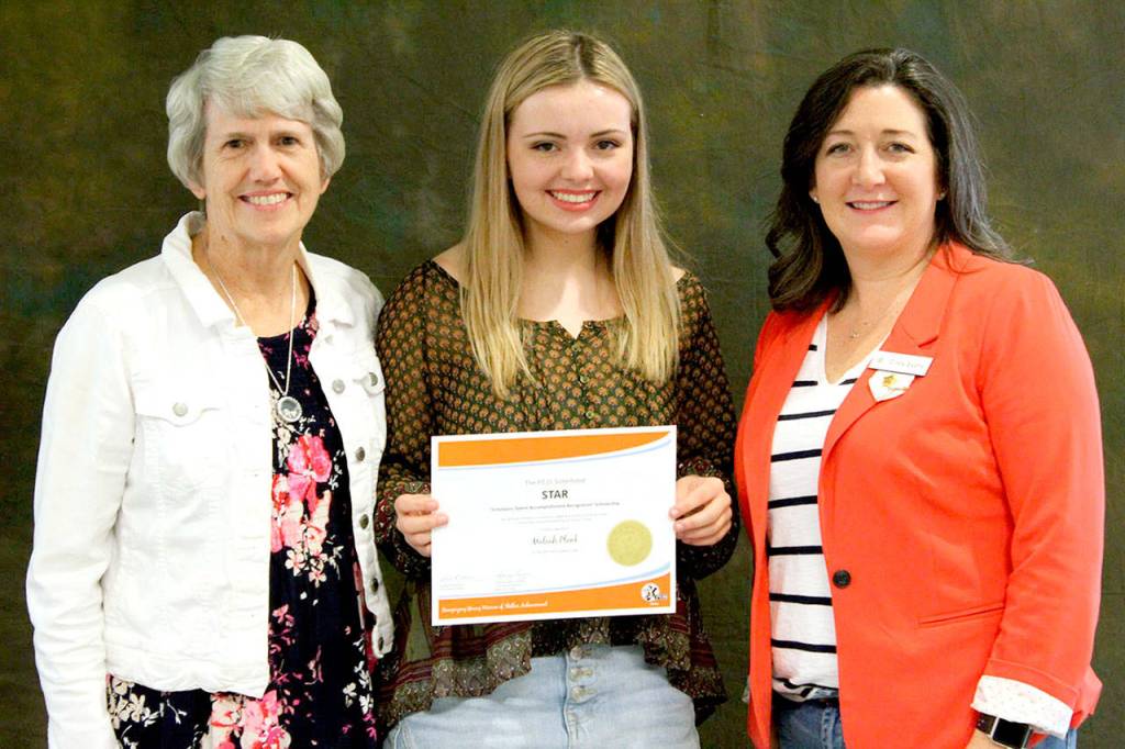 Sharon Bailey (left) and Cindy Evans (right) from Chapter BR presented Meleah Plank a Star Scholarship from PEO International. (Meg McClure)