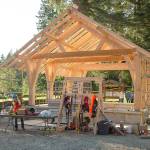 Members of the Timber Framers Guild and volunteers raised a picnic shelter at Lake Roesiger county park in late May. (Rich Patton)