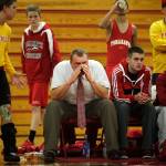 Marysville-Pilchuck head wrestling coach Craig Iversen, center, cheers on his team Dec. 12, 2012 during a nonconference meet against Arlington High School, then coached by his father, Rick Iversen. (Annie Mulligan / Herald file)