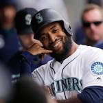 The Mariners Domingo Santana celebrates in the dugout after hitting a solo home run during the seventh inning of a game against the Royals on June 19, 2019, in Seattle. (AP Photo/John Froschauer)