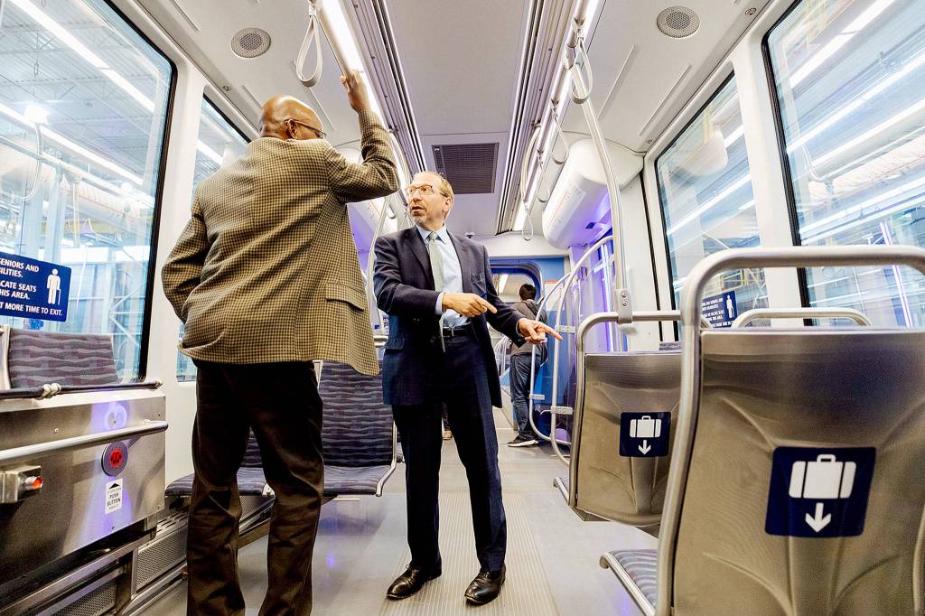 The first Siemens Link light rail vehicle was shown on Wednesday at the Sound Transit maintenance and operations center in Seattle. At right is Sound Transit CEO Peter Rogoff. (Sound Transit)