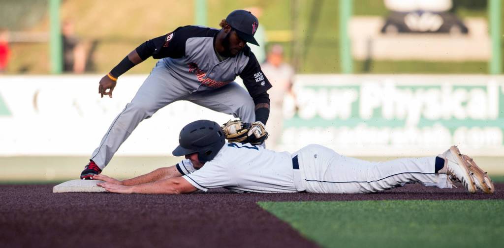 The AquaSoxs Trent Tingelstad beats the tag at second base during Everetts home opener against the Volcanoes on June 21, 2019, at Funko Field at Everett Memorial Stadium. (Andy Bronson / The Herald)