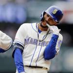 Seattle Mariners J.P. Crawford reacts after hitting a two-run single against the Baltimore Orioles during the third inning of Sundays game in Seattle. (AP Photo/John Froschauer)