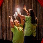 At the end of a rousing performance of the song You Are Holy, Faith Fitch (left) and Angelina Nesterenko end with a high-five. (Dan Bates / The Herald)