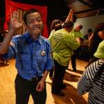 Sam Lu, after his raucus performance of Bad Boys, celebrates the end of All Aboards talent show with other cast members Wednesday night at the Knights of Columbus hall in Everett. (Dan Bates / The Herald)