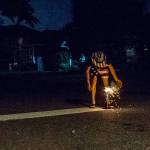 In this 2018 photo, Jeffery Kasch lights fireworks in Everett. Fire officials are hoping to outlaw personal fireworks on the outskirts of Everett, Lynnwood and Edmonds. (Olivia Vanni / Herald file)