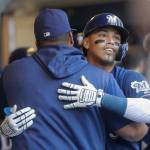 Milwaukee Brewers Orlando Arcia (right) is congratulated by Jesus Aguilar after hitting a three-run home run during the fourth inning of a baseball game against the Seattle Mariners on Thursday in Milwaukee. (Morry Gash / Associated Press)