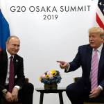 President Donald Trump meets with Russian President Vladimir Putin during a bilateral meeting on the sidelines of the G-20 summit in Osaka, Japan, on Friday. (AP Photo/Susan Walsh)
