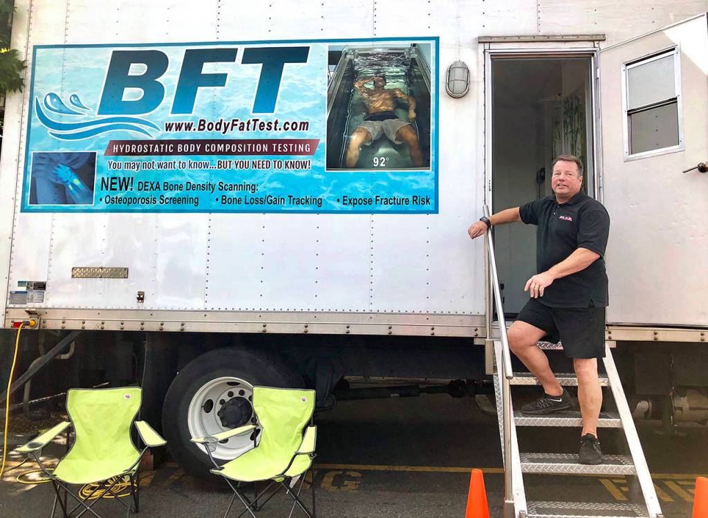 Brian Lee takes his Body Fat Test truck to fitness centers and corporate events. Inside is a dunk tank that measures body composition using the hydrostatic underwater method. (Andrea Brown / The Herald)