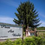 A sign reading, Pause Rest Worship stands outside the Wayside Chapel. (Olivia Vanni / The Herald)