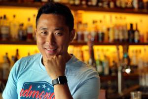 Shubert Ho and his Edmonds Kind of 4th T-shirts and hats being sold to raise money for SnoCo Fire dept. The project was started by Ho in gratitude to firefighters for saving one of his restaurants when a building next door was on fire. (Kevin Clark / The Herald)