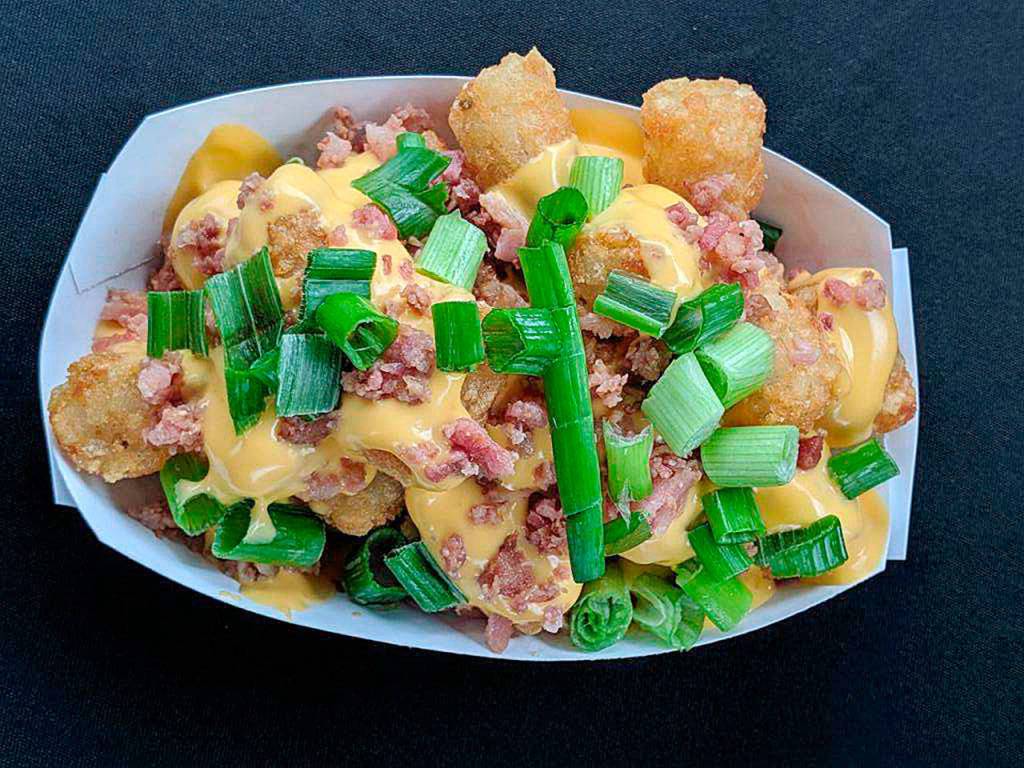 The loaded tater tots, with green onions, bacon and cheese, are new this year at Funko Field. (Rick Maddox)