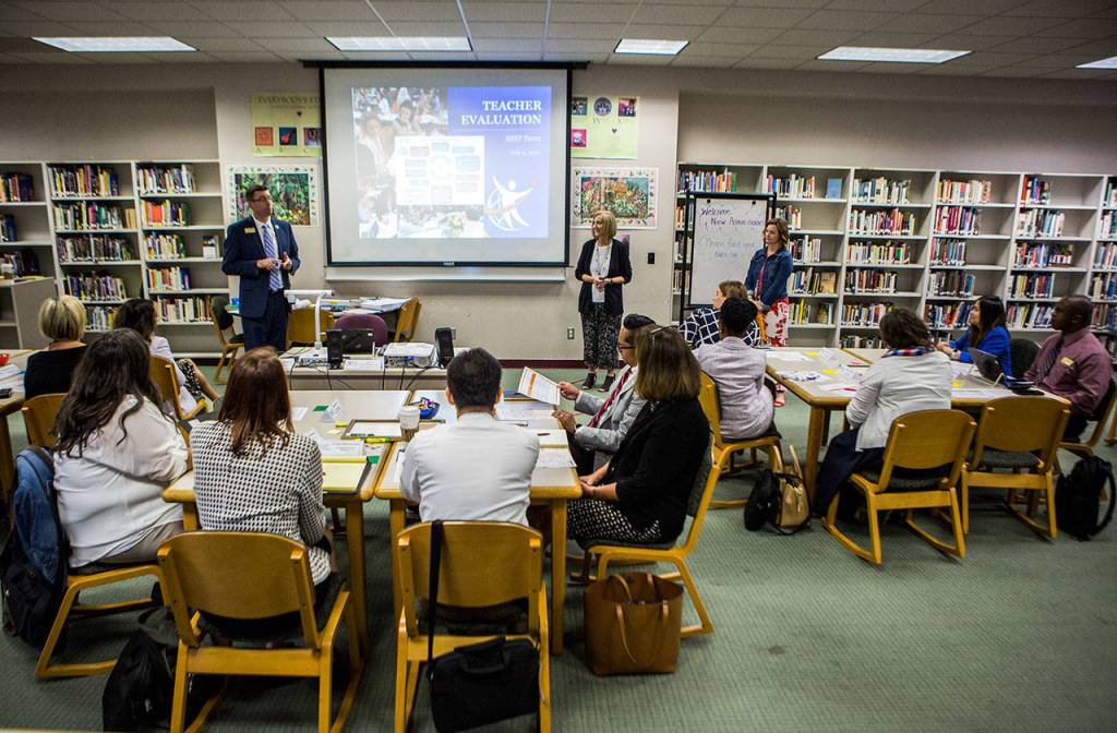 New administrators listen before the start of the Teacher Evaluation portion of the school stops. (Olivia Vanni / The Herald)