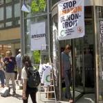 Environmental activists mount a passive protest targeting the Amazon headquarters building in Paris, France, on Tuesday, accusing the online distribution company of destroying jobs and hurting the planet. Several dozen demonstrators climbed a fence and forced their way into the Amazon offices in northern Paris, where they spoke with employees and staged a sit-in at the security entrance. (AP Photo)