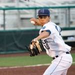 AquaSox pitcher Juan Then throws to first base during a game against the Hawks on July 2, 2019, at Funko Field at Everett Memorial Stadium. (Katie Webber / The Herald)