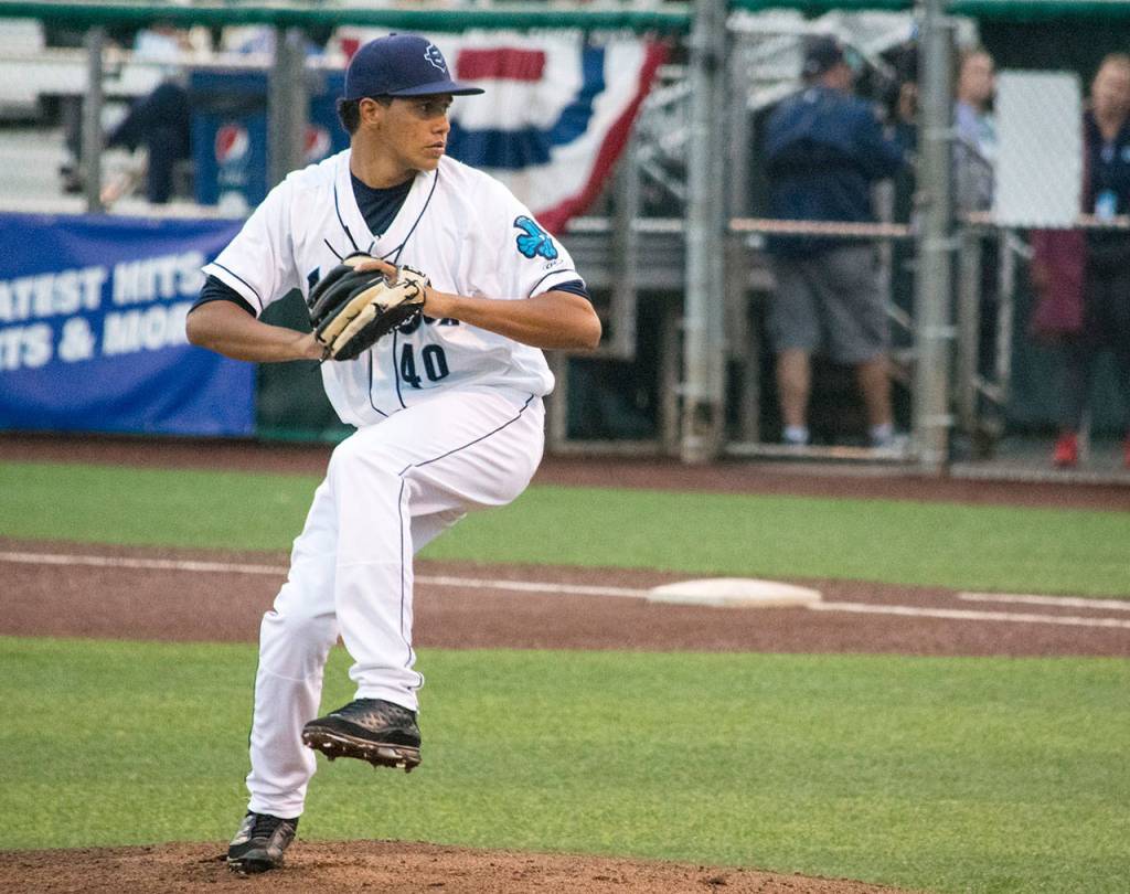 Juan Then pitches for the AquaSox during a game against the Hawks on July 2, 2019, at Funko Field at Everett Memorial Stadium. (Katie Webber / The Herald)