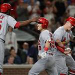 The Cardinals Tommy Edman (center) is congratulated by Dexter Fowler (25) and Tyler ONeill after his three-run home run against the Mariners during the ninth inning of a game on July 3, 2019, in Seattle. (AP Photo/Elaine Thompson)