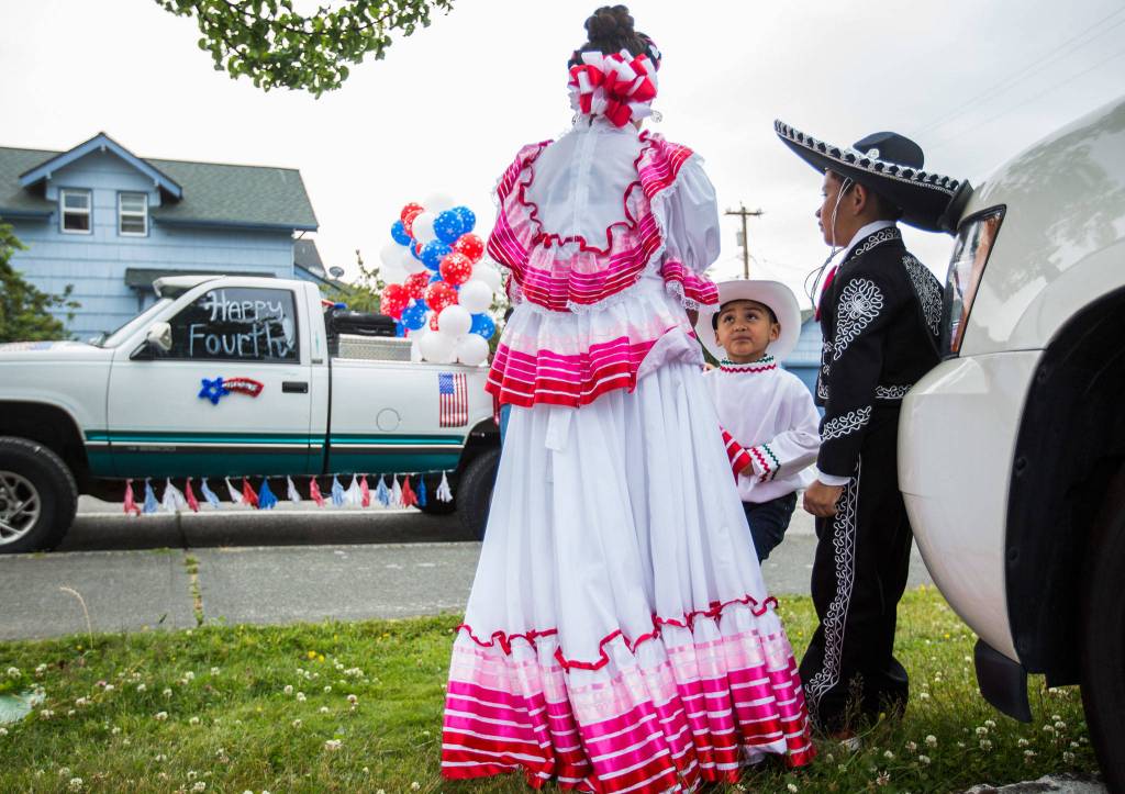 Oscar Suarez, 6, waits for the start of the parade during the Colors of Freedom Fourth of July Parade on Thursday, July 4, 2019 in Everett, Wash. (Olivia Vanni / The Herald)