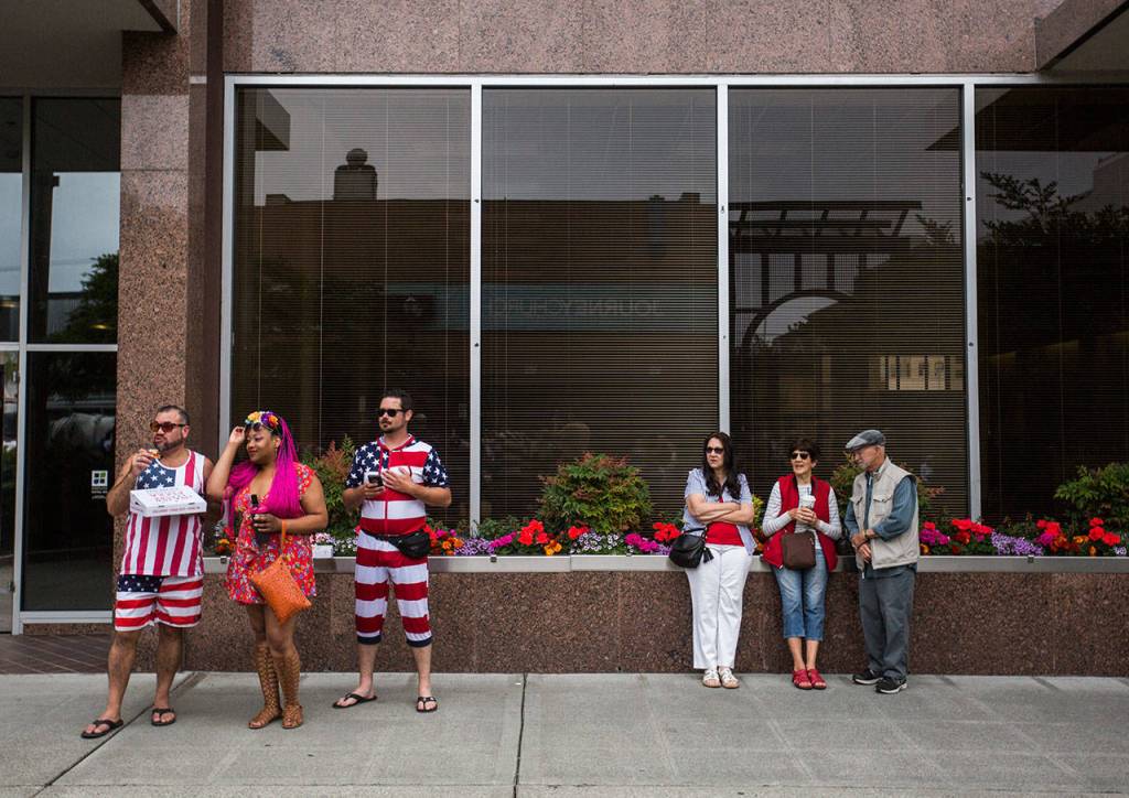 People gather to watch the parade during the Colors of Freedom Fourth of July Parade on Thursday, July 4, 2019 in Everett, Wash. (Olivia Vanni / The Herald)