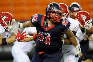 Torn pec and all, UW freshman Tuitele remains undaunted