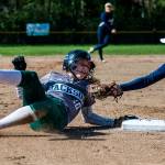 Jacksons Macy Tarbox safely slides into third base while Glacier Peaks Harlee Carpenter reaches out to tag her during a game at Jackson High School on April 24 in Mill Creek. (Olivia Vanni / The Herald)