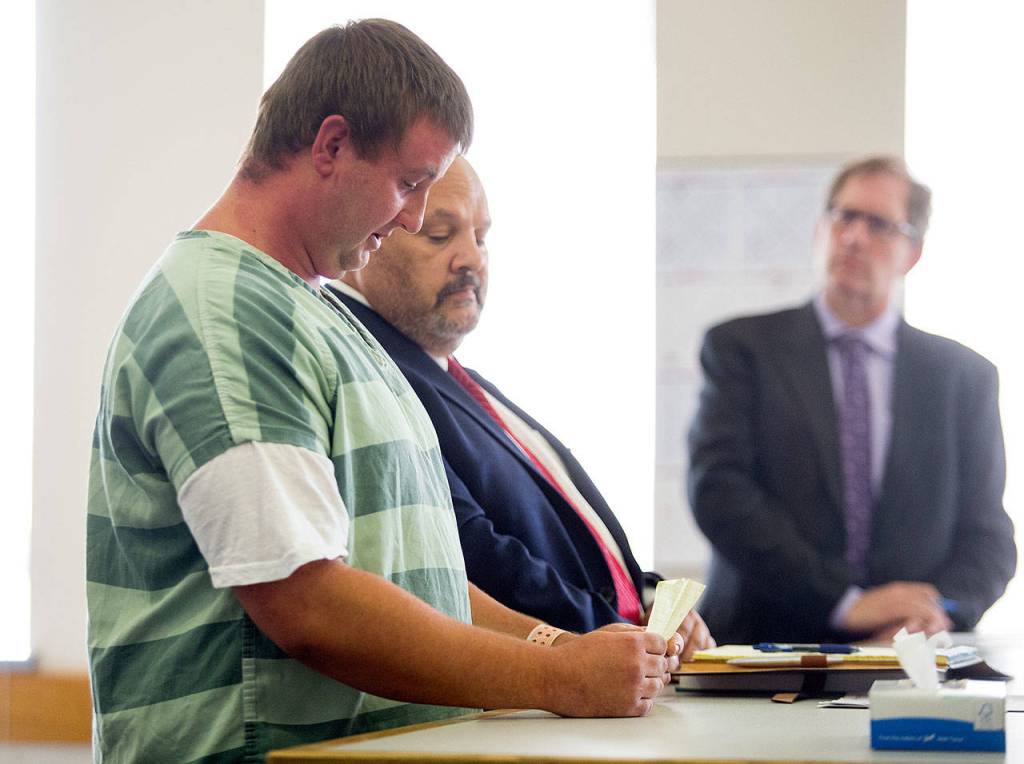 Michael Spieker reads a statement to the court before he is sentenced Thursday at the Snohomish County Courthouse. (Andy Bronson / The Herald)