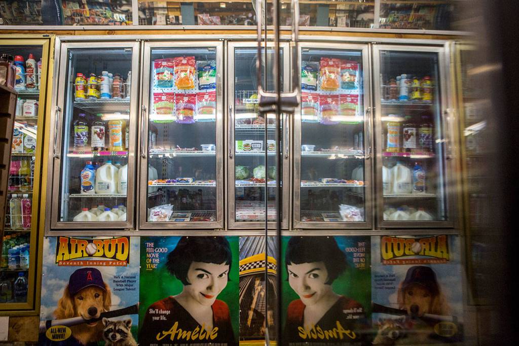 Old movie posters line the walls and freezers of Turners Neighborhood Grocery. (Olivia Vanni / The Herald)