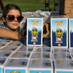 Lily Lamoureux stacks Weebly Funko Pop! toys in preparation for Funko Friday at Funko Field in Everett on July 12, 2019. (Kevin Clark / The Herald)