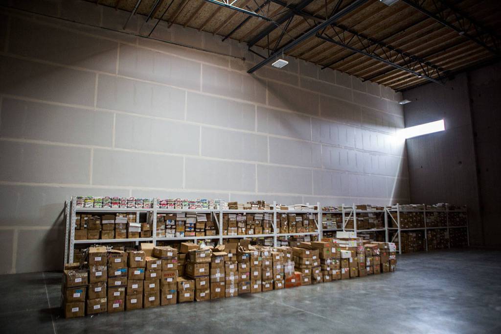 Light shines in through a window in FossilEras new warehousein Monroe. (Olivia Vanni / The Herald)