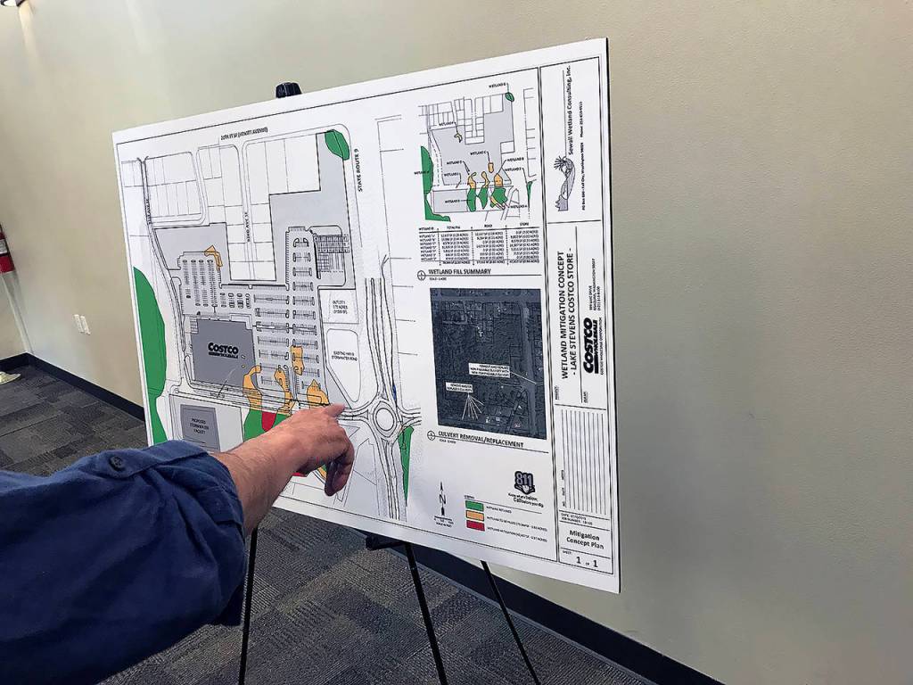 Poster boards at Thursdays meeting included information about the wetlands on the proposed site, traffic increases and preliminary designs of the store. (Stephanie Davey / The Herald)