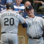 The Mariners Daniel Vogelbach is congratulated by manager Scott Servais after hitting a home run during a game against the Brewers on June 25, 2019, in Milwaukee. (AP Photo/Morry Gash)