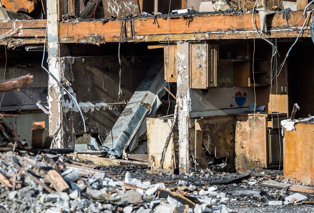A painting can be seen along one of the remaining structure walls of the Judd & Black building Friday in Everett. (Olivia Vanni / The Herald)