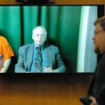 Matthew Timothy Wetherington, left, and public defender Harry Gasnick appear by video in Clallam County Superior Court in Port Angeles on Wednesday as Deputy Prosecuting Attorney Steve Johnson, right, addresses the court. (Keith Thorpe/Peninsula Daily News)
