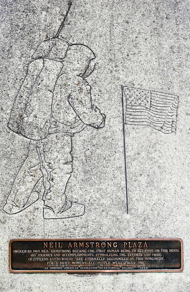 A bronze inlay of astronaut Neil Armstrong walking on the moon is part of a concrete monolith outside the Public Safetly Complex in Edmonds. The statue was a bicentennial project in 1976. (Dan Bates / The Herald)