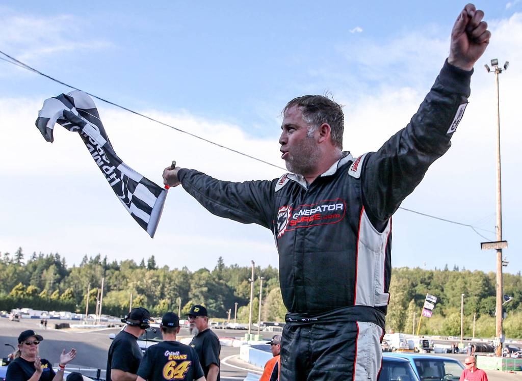 Preston Peltier celebrates his first place in the 8th Annual Summer Showdown at the Evergreen Speedway in Monroe on June 30. (Kevin Clark / The Herald)
